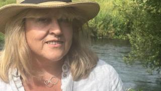 women by river